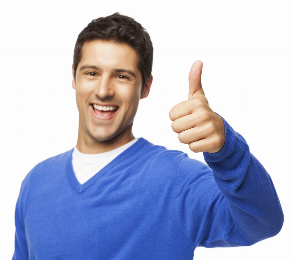Handsome Young Man Gesturing Thumbs Up - Isolated